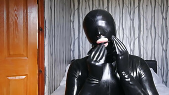 Rubberized Slave Submits To Blindfold, Gag, And Gas Mask